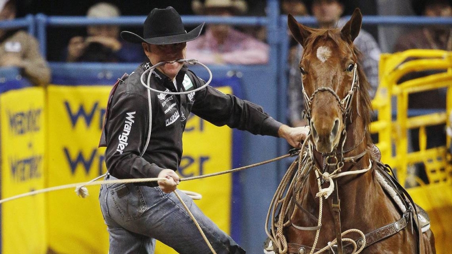 Trevor Brazile competes in the tie-down roping event during the 2015 National Finals Rodeo